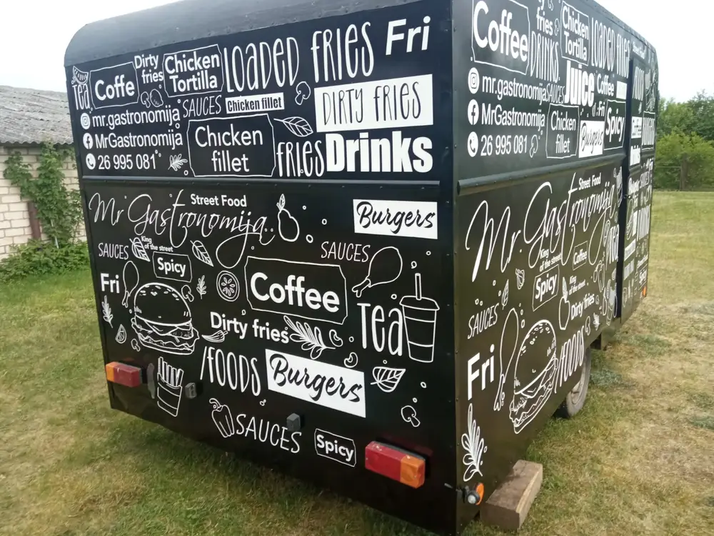 Black street food trailer with white lettering: Mr Gastronomija, Burgers, Coffee and Fries