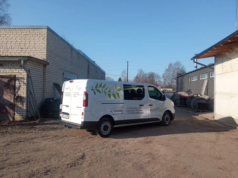 White Renault van with leaf graphics, the KCE logo and a list of services