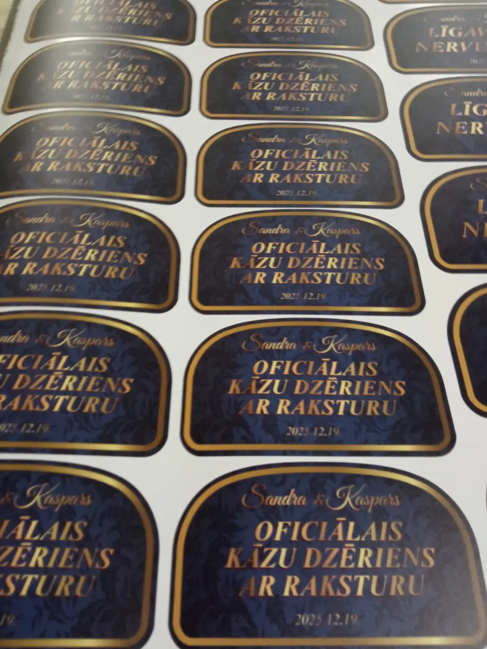 Sheet of labels reading "Oficiālais kāzu dzēriens ar raksturu"